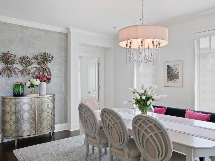Tampa dining room with striking light fixtures designed by Home Frosting
