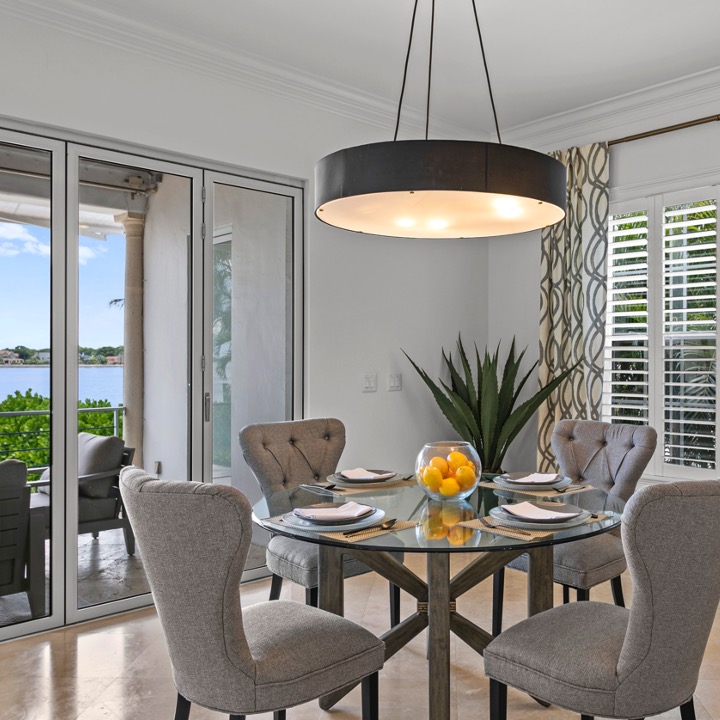 Tampa dining room with statement lighting fixtures designed by Home Frosting